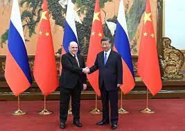 میخائیل میشوستین، نخست وزیر روسیه، در 24 مه 2023 با رئیس جمهور چین، شی